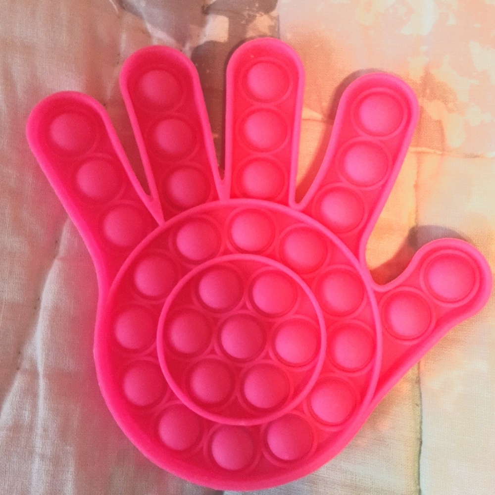 Hot pink hand pop it